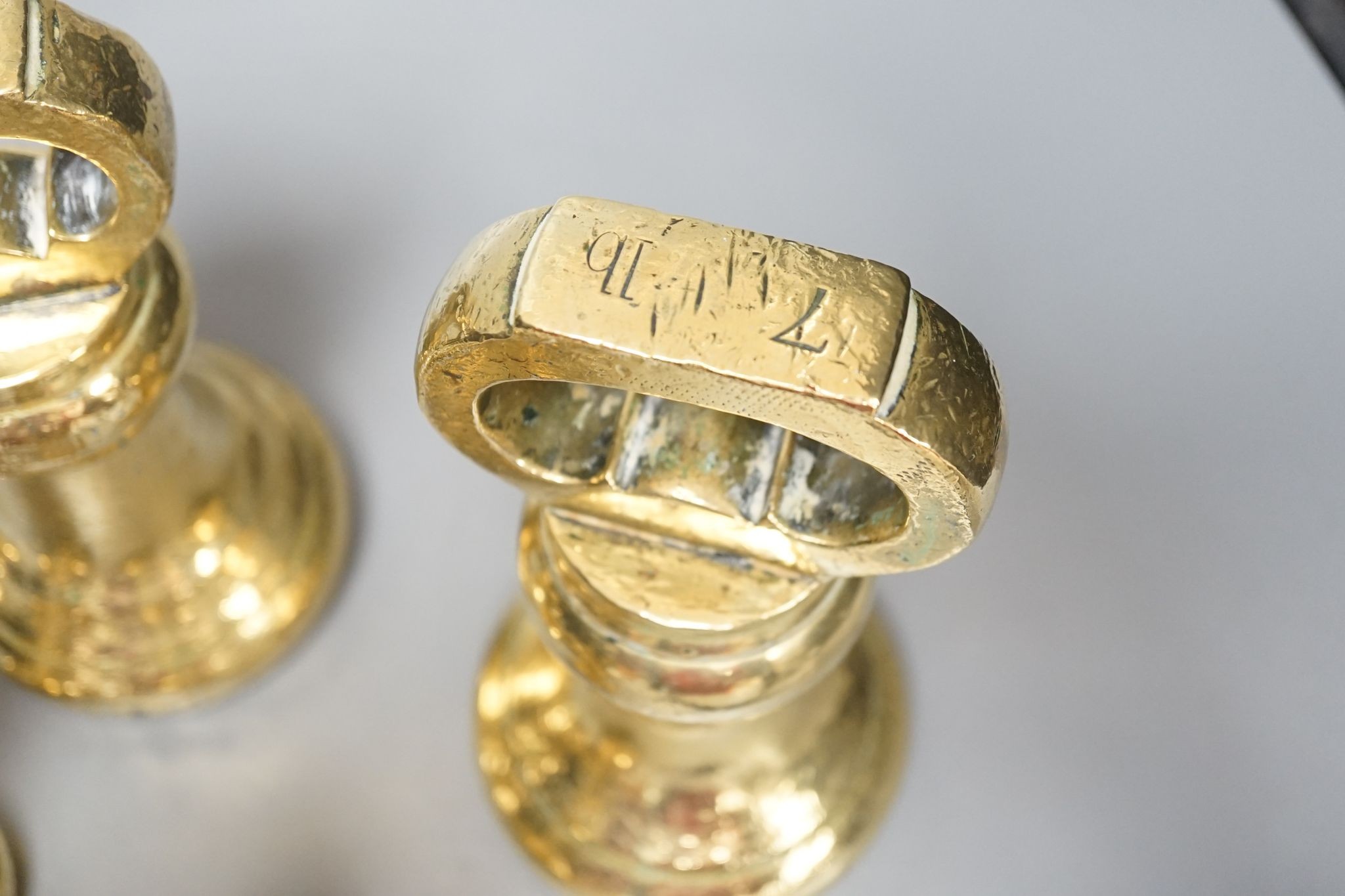 A set of 5 Victorian graduated cast brass bell weights and 3 graduated cast brass disc weights (8) 18cm